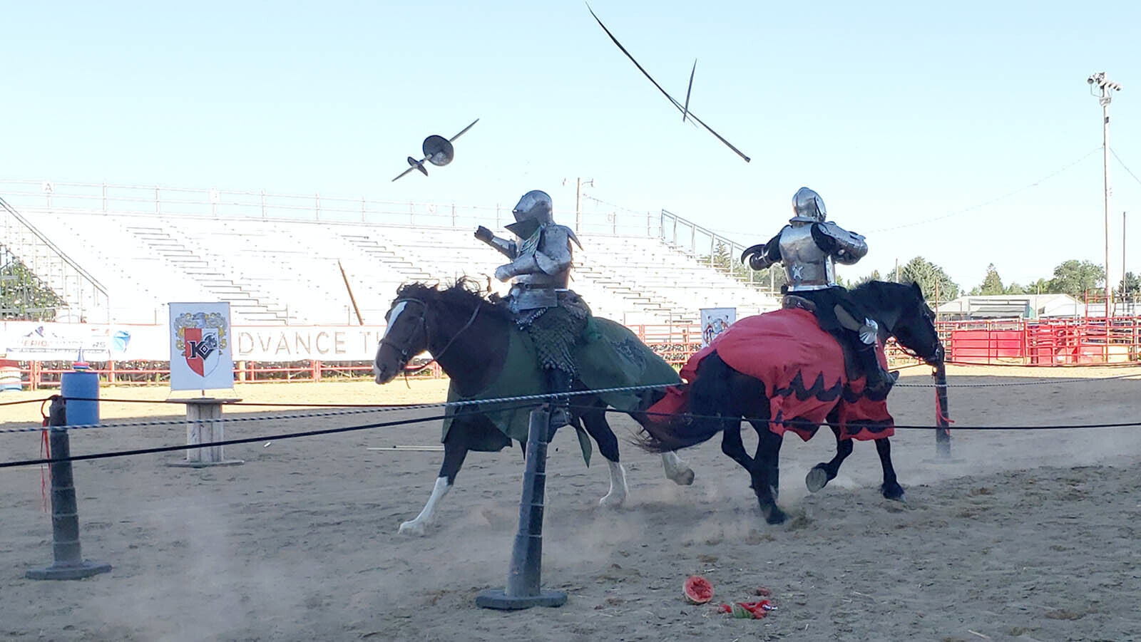 Lances fly after impact during jousting.