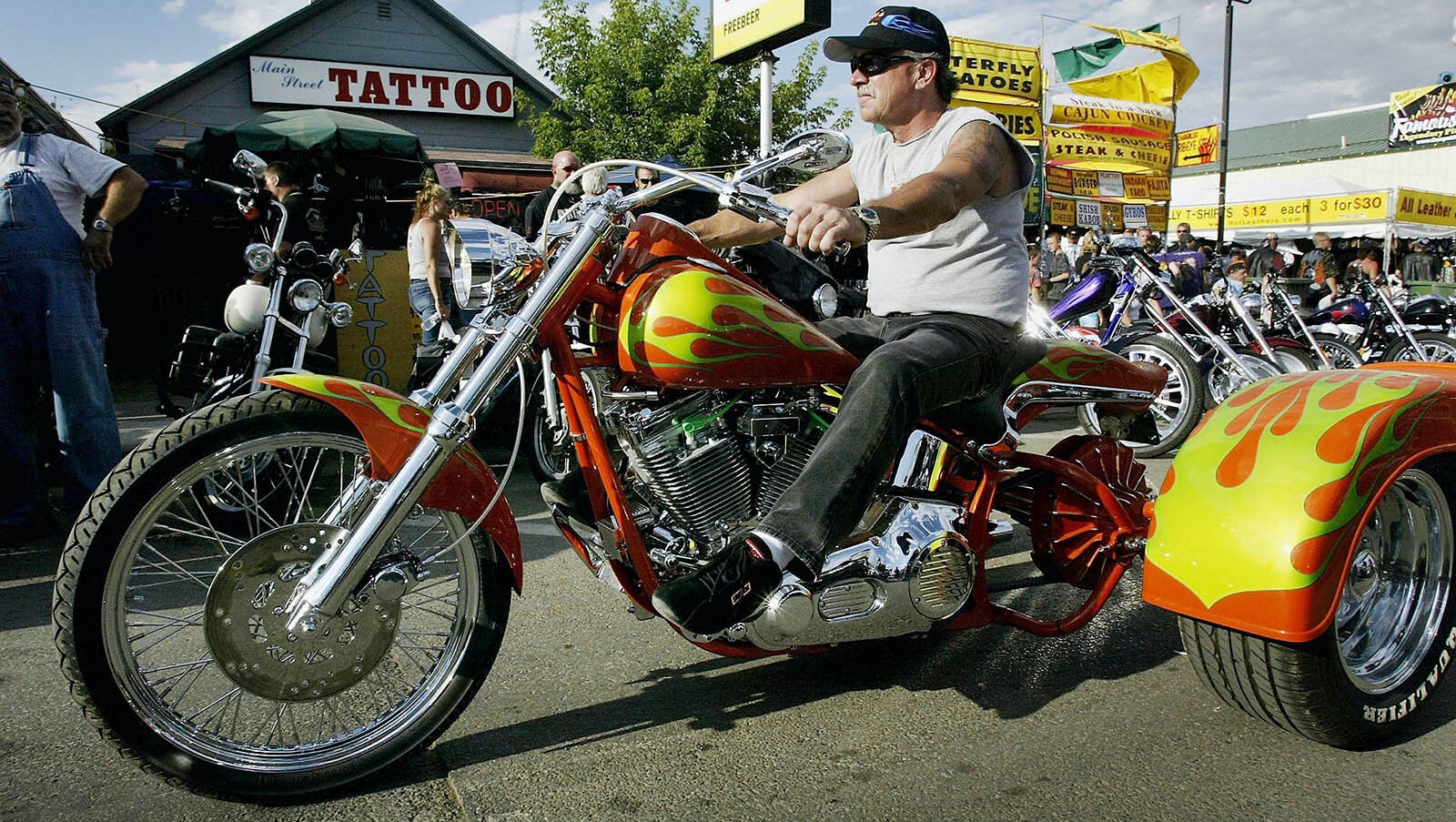 A Biker on a trike rides through downtown Sturgis during the start of the annual Sturgis Motorcycle Rally.